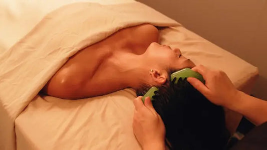 woman enjoying stone massage